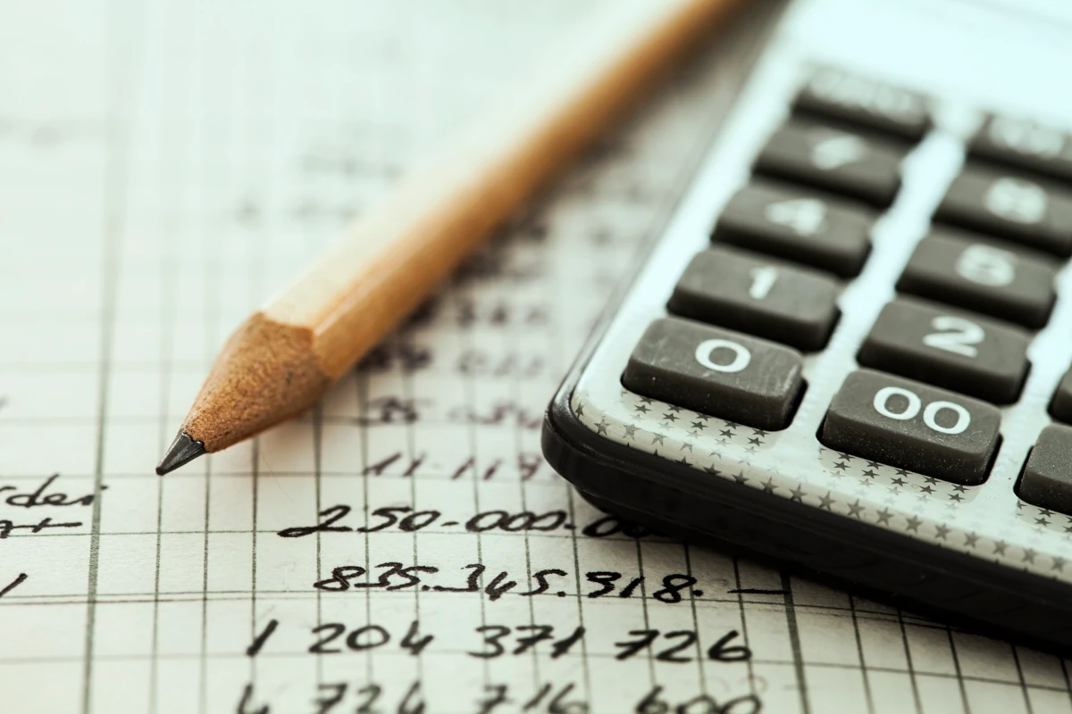 Calculator and pencil on paper
