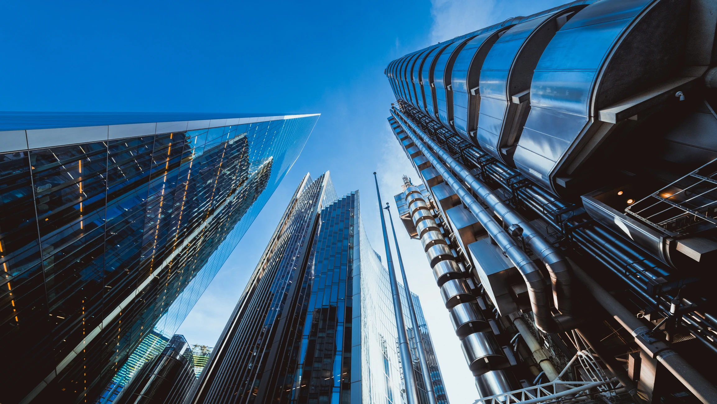 Looking directly up at the skyline of the financial district in central London