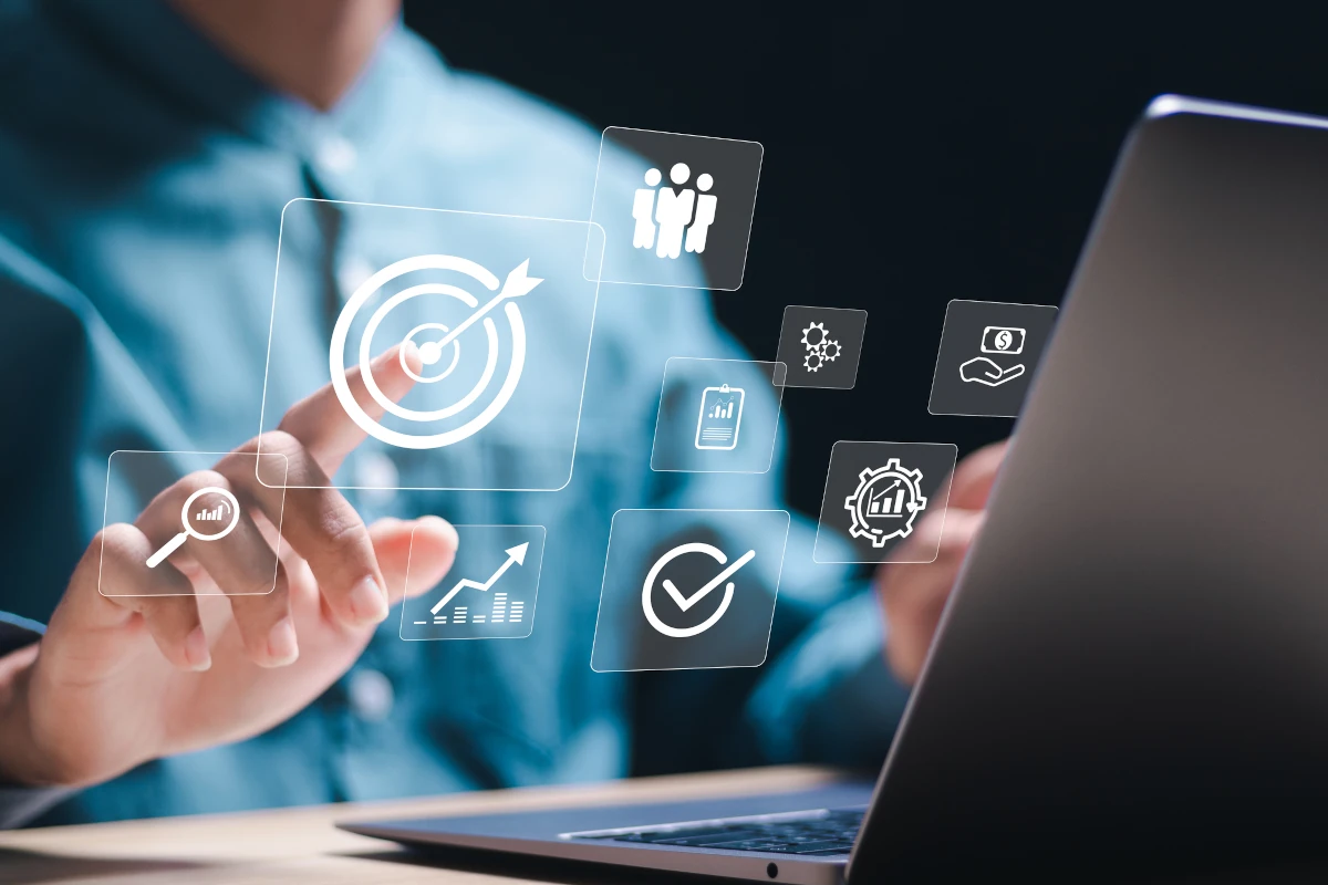 Person using laptop with target icons