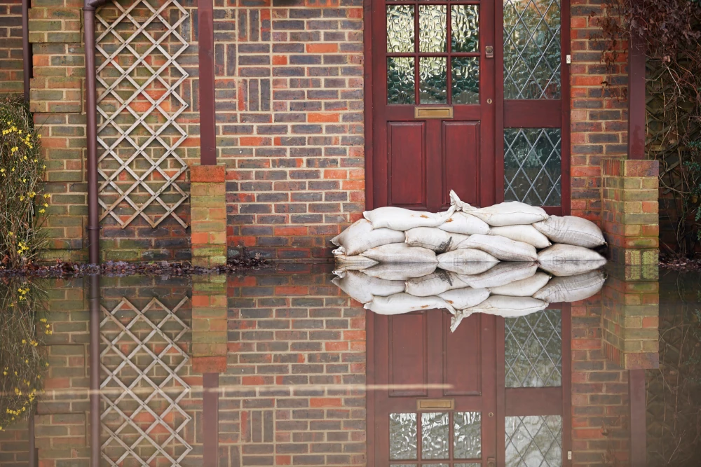 Sandbags near house door during flood.