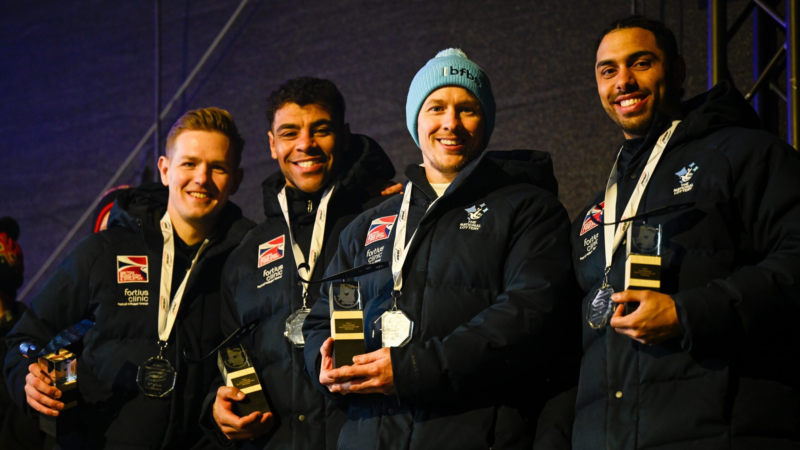 GB Bobsled team holding trophies